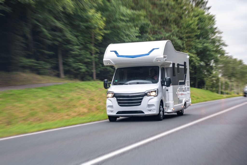 white-camper-van-road-travel-motion-blur-speed-freedom (1)